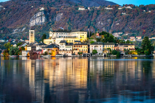 istock Orta San Giulio island, winter sunrise panorama. 1353027727