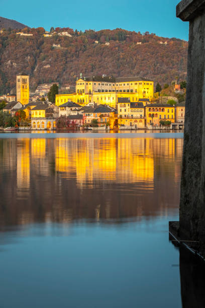 istock Orta San Giulio island, winter sunrise panorama. 1353027731