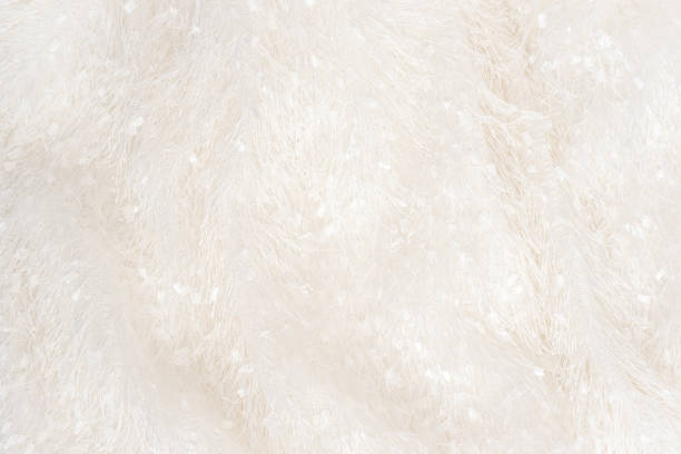istock Texture of soft white plaid surface with long natural fur 1353031639