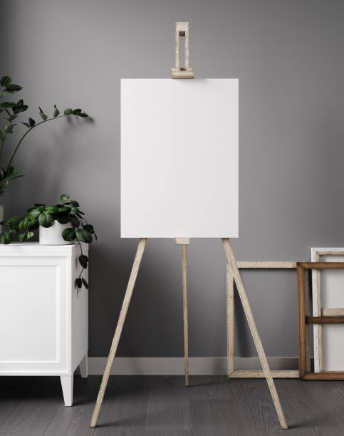 istock White blank canvas on wooden easel, in minimal living room interior. 3d rendering 1353031710