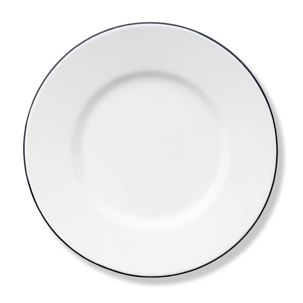istock Round white enameled metal plate on a white background. 1353032824