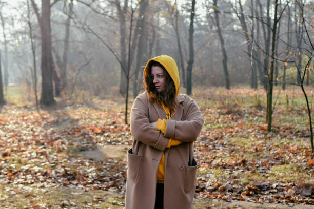 istock Woman in forest holding hand 1353032839