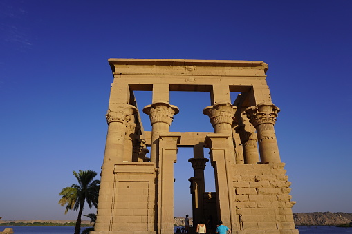 Aswan, Egypt - April 28, 2023: Trajan's Wharf and Philae Temple on Agilkia Island
