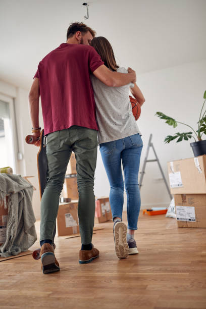 istock Couple in new home.packing, moving, concept 1353037605