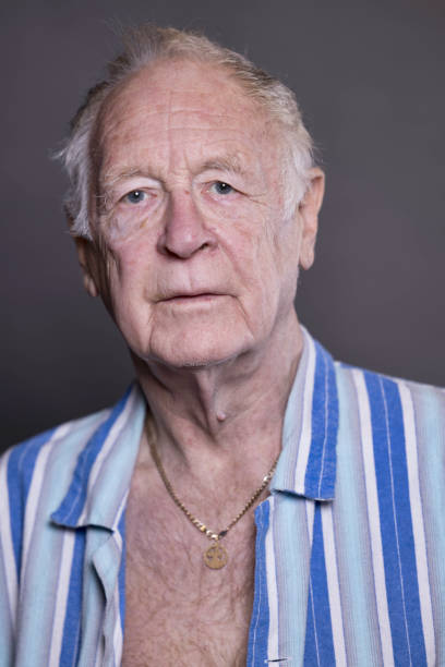 istock Elderly man wearing striped pajamas 1353038609