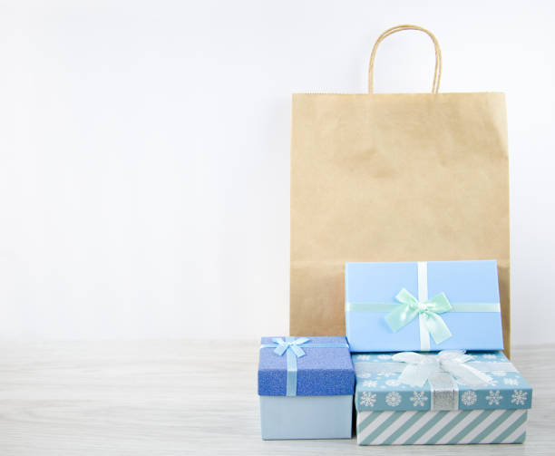 istock Blue boxes with Christmas gifts and a craft package 1353040615