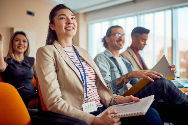 istock Business woman on conference meeting seminar training. 1353043757