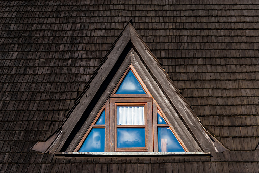 Triangular wooden skylight with glass