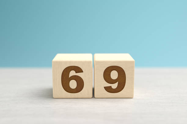 istock Wooden toy blocks forming the number 69. 1353046511