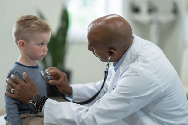 istock Listening to a Little Boys Heart 1353047412