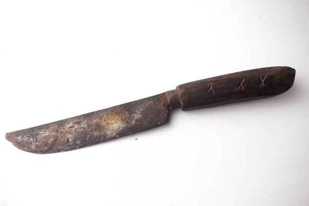 istock old Rusty knife with wooden handle isolated 1353048973