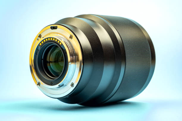 istock Optical digital camera lens isolated on blue background. 1353051186