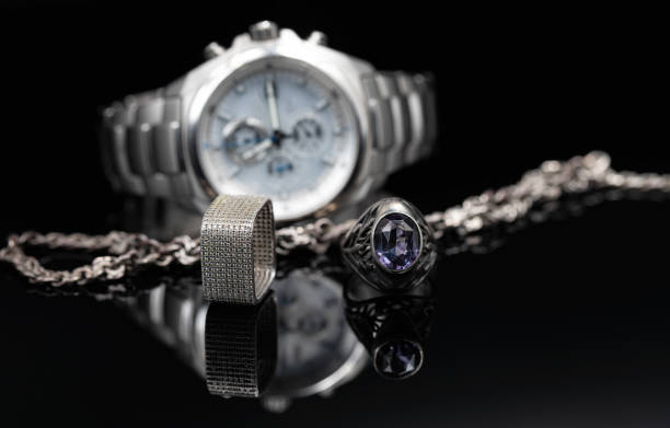 istock Different shades of silver: titanium watches, silver rings and chain 1353055247