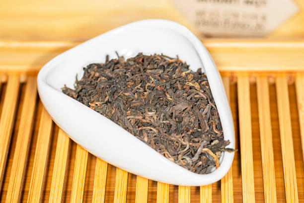 istock Chinese bulk extruded tea ripe Puer in tea presentation vessel 1353055781
