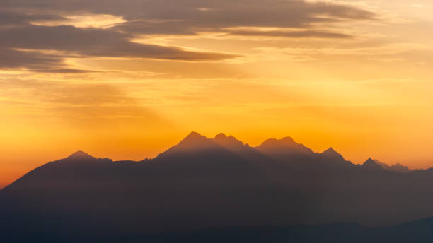 istock Dark mountain peaks in the setting sun, Tatra Mountains, Poland 1353055877