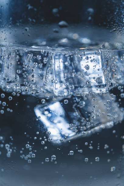 istock Pour Soda Into Ice Cubes In Glass 1353057231