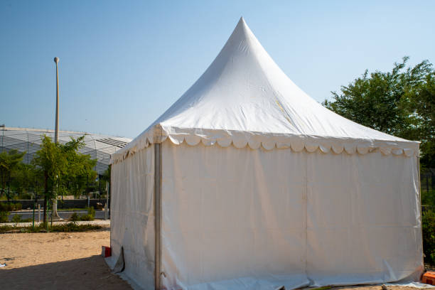istock Tent in a field under the sunny sky 1353062724