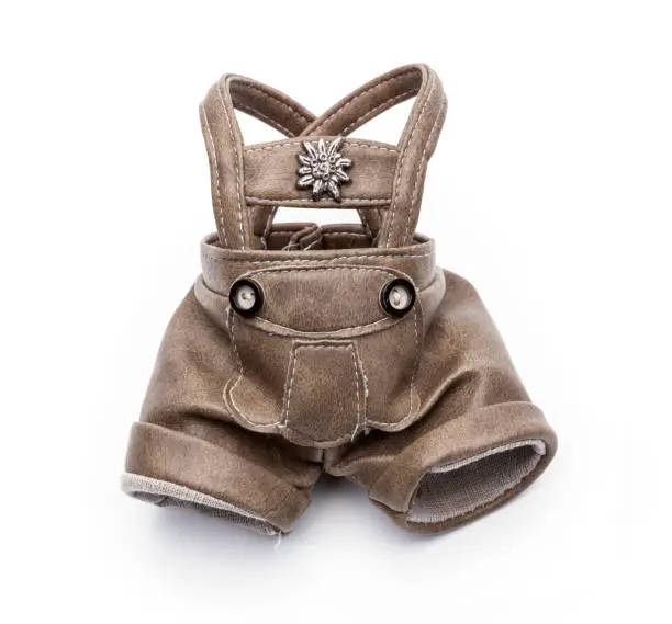 Lederhosen of a doll insulated on a white background
