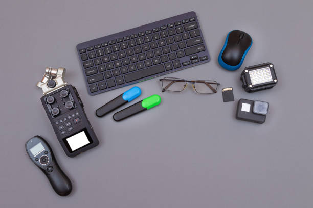 istock Digital Gadgets on Grey Table - Video Blogger's Workplace 1353066269