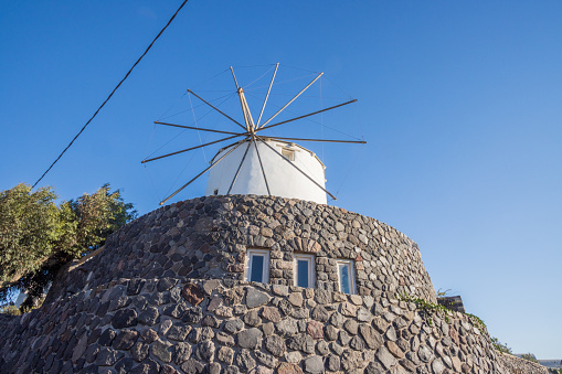 Traditional Windmill serving as a holiday villa in Pyrgos Kallistis on Santorini, Greece