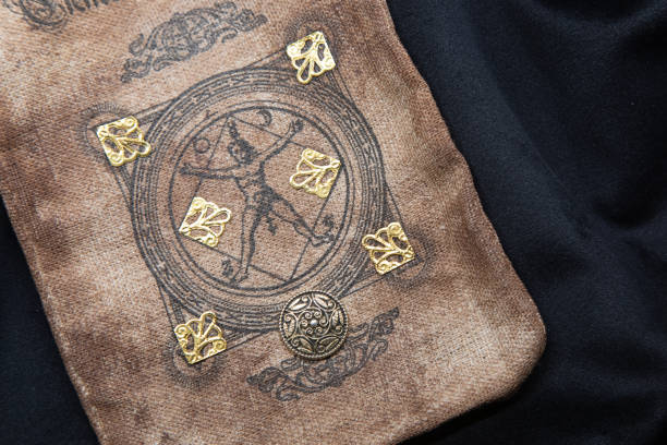 istock Ancient esoteric witchcraft background. Occultims and paganism old symbol, with mysterious runes alphabet 1353066694