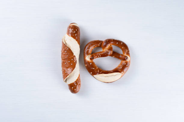 istock Appetizing Bavarian pretzel and roll isolated on a white background. Top view, copy space, isolated 1353070663