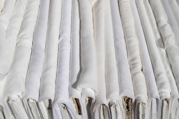 Detailed close up view on samples of cloth and fabrics in different colors found at a fabrics market.