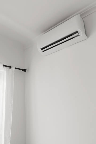 istock Flat air conditioner on white wall in room interior 1353075278