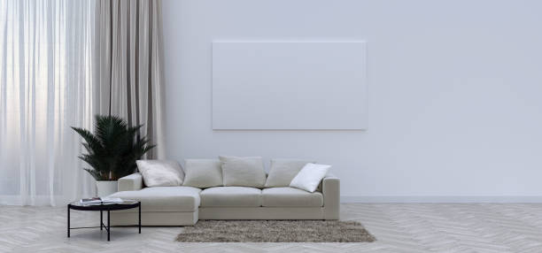 istock 3D interior of bright living room with biege sofa, pillows on the sofa, plant and coffee table with opened book on it. 1353075607