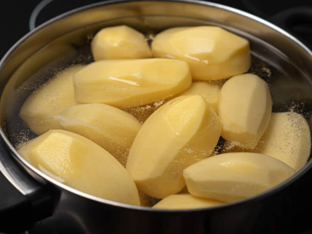 istock Cooking potatos in boiling water in saucepan 1353076283