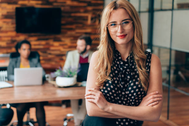istock Young businesswoman's portrait at work 1353079112