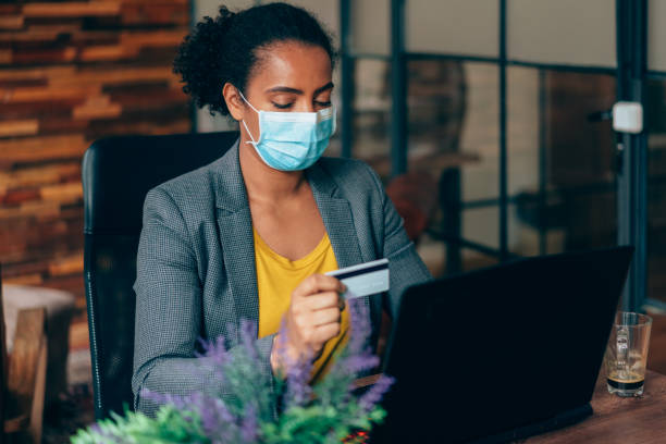 istock Business people using online banking, COVID-19 pandemic 1353079142