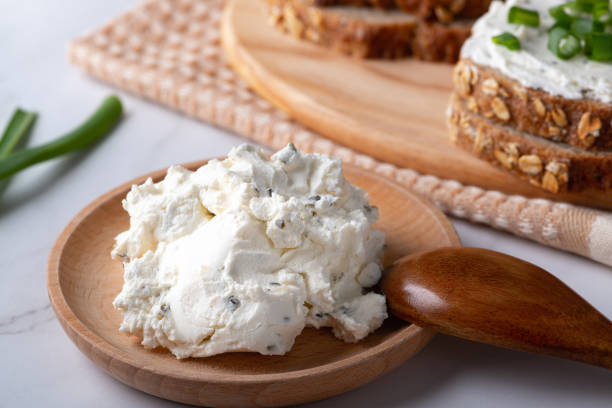 rye bread on the plate with curd cheese and green onion. health food. - cream cheese imagens e fotografias de stock