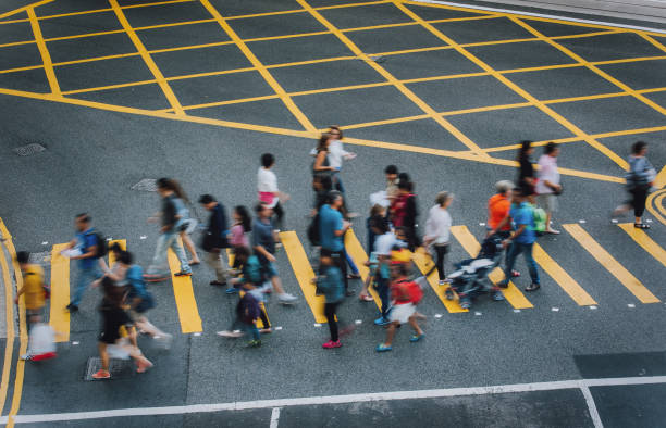 香港、中国の横断歩道 - crosswalk crowd activity long exposure ストックフォトと画像