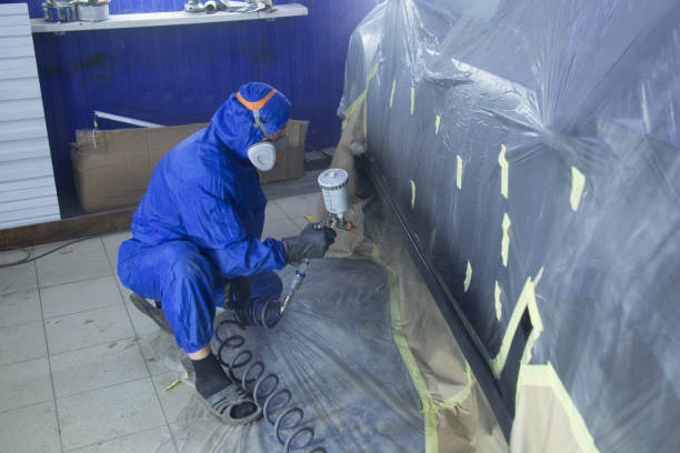 istock Painting the thresholds of the car. 1353082741