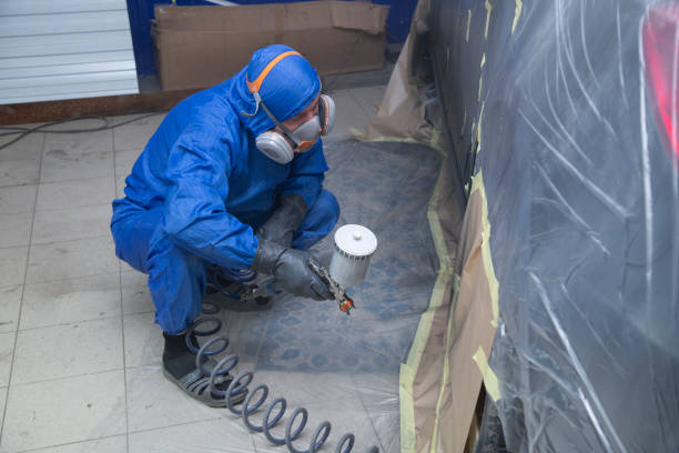 istock Painting the thresholds of the car. 1353082883
