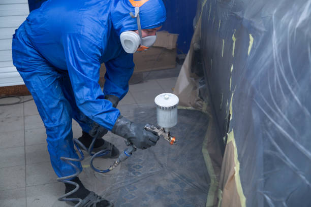 istock Painting the thresholds of the car. 1353082904