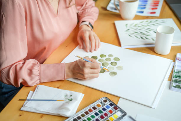istock woman artist at work 1353087675