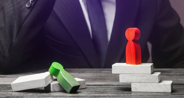 istock Green human figure is defeated in confrontation with opponent. Loss, failure. Mistake handling. Weakness incompetence, victory of a stronger opponent. Unprofessional. Diplomacy. Underestimating enemy 1353092013