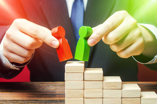 istock Businessman decides to choose which candidates is best for a leadership position. Head Offset. Change of power. HR management. Staff update. Business optimization, replacement employees with new loyal 1353092186