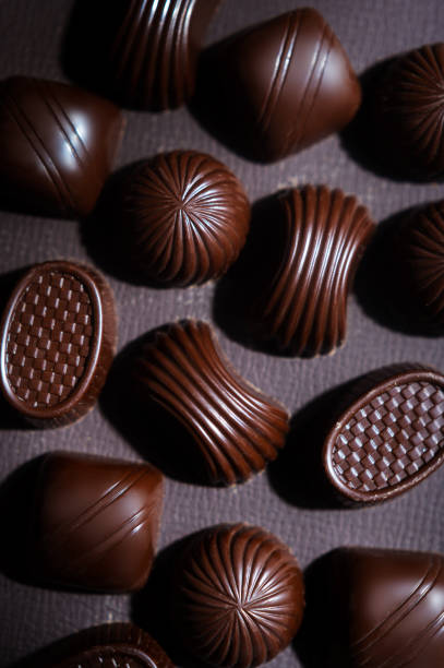 istock Dark bitter chocolate candies in a box 1353093520