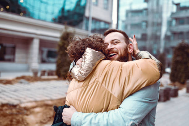 istock Couple Embracing After Not Seeing Each Other For A Long Time 1353094581