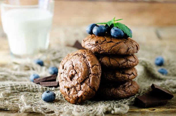 istock Chocolate brownie cookies with berries and mint leaves 1353095019