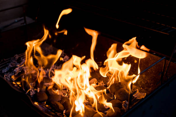 istock Fire flames with reflection on black background.abstract fire .flame of fire with sparks. 1353096373