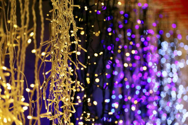 istock Christmas lights on electric garlands in a shop window 1353097702