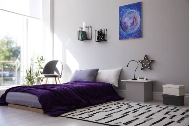 istock Modern teenager's room interior with comfortable bed and stylish design elements 1353098103