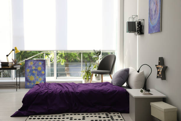 istock Modern teenager's room interior with comfortable bed and stylish design elements 1353098130