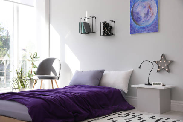 istock Modern teenager's room interior with comfortable bed and stylish design elements 1353098257