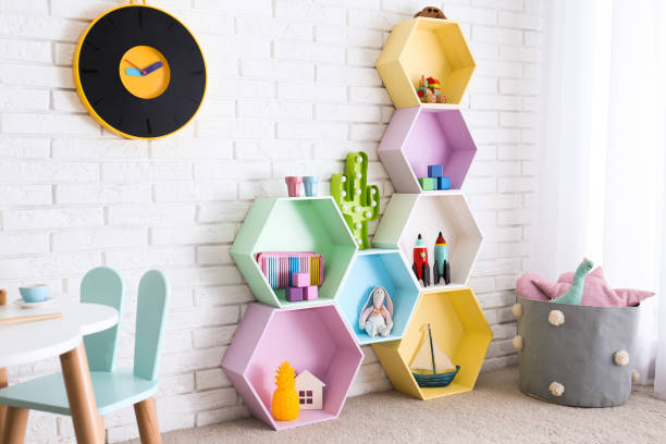 Child room interior with colorful shelves near brick wall