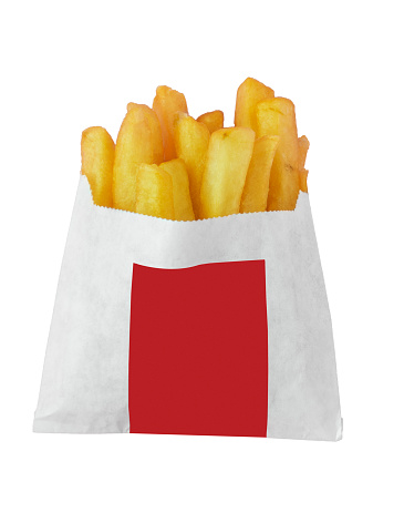 French fries in a paper bag on a green background